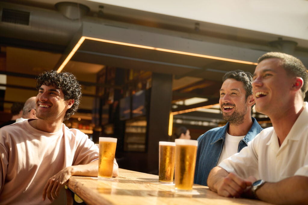 Guys drinking beer at Battery house bar at DYRSL